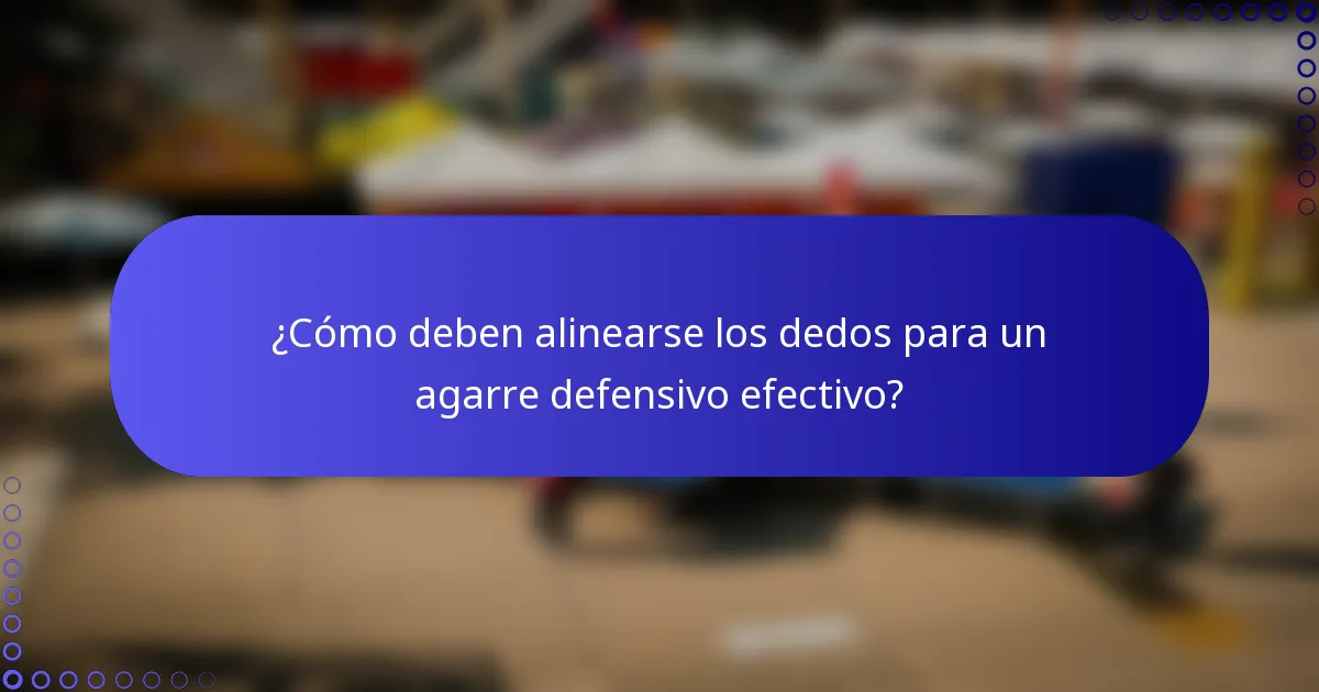 ¿Cómo deben alinearse los dedos para un agarre defensivo efectivo?